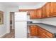 Cozy kitchen featuring wood cabinets and updated countertops at 11431 Nw 100Th St, Ocala, FL 34482