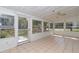 Bright sunroom with tiled floors and access to the backyard at 11431 Nw 100Th St, Ocala, FL 34482