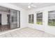 Sunroom with tiled floor and access to backyard at 11431 Nw 100Th St, Ocala, FL 34482