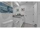 Modern bathroom with granite vanity and white cabinets at 1235 Fan Palm Dr, Davenport, FL 33897