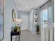 Bright and airy entryway with tile flooring and a modern console table at 1235 Fan Palm Dr, Davenport, FL 33897