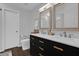 Bathroom with double vanity, marble countertops, and gold accents at 1255 Blackwater Pond Dr, Orlando, FL 32828