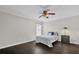 Bright bedroom with dark wood floors, ceiling fan, and ample closet space at 1255 Blackwater Pond Dr, Orlando, FL 32828