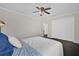 Spacious bedroom with a queen-size bed, dark floors, and built-in closet at 1255 Blackwater Pond Dr, Orlando, FL 32828