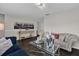 Living room with dark hardwood floors, couches, and a coffee table at 1255 Blackwater Pond Dr, Orlando, FL 32828