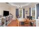 A dining area with a wooden table and built-in shelves at 14087 Bradbury Rd, Orlando, FL 32828