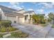 Two-car garage, mature landscaping, and a charming facade at 14087 Bradbury Rd, Orlando, FL 32828