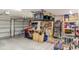 Spacious garage with overhead storage and workbench at 14087 Bradbury Rd, Orlando, FL 32828