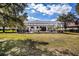 Large backyard showcasing the house and screened pool at 1458 Foxtail Dr, Lake Mary, FL 32746