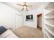 Bedroom with TV, built-in shelving, and closet at 1458 Foxtail Dr, Lake Mary, FL 32746