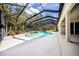 Extended patio area with a view of the screened pool and spa at 1458 Foxtail Dr, Lake Mary, FL 32746