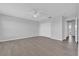 Well-lit bedroom featuring wood-look flooring, ample closet space, and a ceiling fan at 15199 Sugargrove Way, Orlando, FL 32828