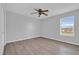 Bedroom with neutral color scheme, ceiling fan and a window with blinds at 15199 Sugargrove Way, Orlando, FL 32828