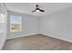 Bedroom with hardwood floors, neutral walls, window and ceiling fan at 15199 Sugargrove Way, Orlando, FL 32828