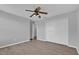 Light-filled bedroom with wood-look floors, a closet, and a view into the hallway at 15199 Sugargrove Way, Orlando, FL 32828