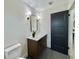 Contemporary bathroom with dark brown vanity and marble countertop at 1933 Winnebago Trl, Fern Park, FL 32730