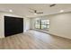 Bright bedroom with hardwood floors and black doors at 1933 Winnebago Trl, Fern Park, FL 32730