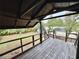 Wooden deck overlooking backyard with treetop views at 1933 Winnebago Trl, Fern Park, FL 32730