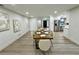 Modern dining room with wood table and view into kitchen at 1933 Winnebago Trl, Fern Park, FL 32730