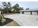 Spacious backyard with three-car garage and basketball court at 1933 Winnebago Trl, Fern Park, FL 32730