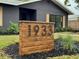 Custom wood house number plaque adds curb appeal at 1933 Winnebago Trl, Fern Park, FL 32730