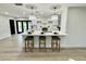 Modern kitchen with island and white cabinetry at 1933 Winnebago Trl, Fern Park, FL 32730