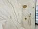 Large walk-in shower with marble tile and rainfall shower head at 1933 Winnebago Trl, Fern Park, FL 32730