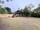 Wooden treehouse with stairs in the backyard at 1933 Winnebago Trl, Fern Park, FL 32730