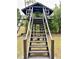 Detailed view of the treehouse stairs at 1933 Winnebago Trl, Fern Park, FL 32730