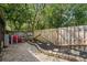 Small paved backyard with wooden fence and landscaping at 194 Post Way, Casselberry, FL 32707