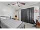 Simple bedroom with a bed, desk, and access to other rooms at 194 Post Way, Casselberry, FL 32707