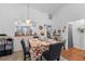 Bright dining room with a table set for four and kitchen view at 194 Post Way, Casselberry, FL 32707