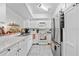 Modern white kitchen with marble countertops and stainless steel appliances at 194 Post Way, Casselberry, FL 32707