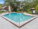 Community pool with surrounding sand and patio area at 194 Post Way, Casselberry, FL 32707