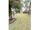 Landscaped backyard with grassy area at 209 San Carlo Rd, Davenport, FL 33896