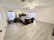 Large bedroom with wood-look floors and ceiling fan at 209 San Carlo Rd, Davenport, FL 33896