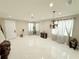 Light-filled living room, tile floors, and neutral walls at 209 San Carlo Rd, Davenport, FL 33896