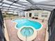 Inviting kidney-shaped pool with spa at 209 San Carlo Rd, Davenport, FL 33896