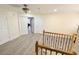 Spacious upper hallway with wood-look floors and multiple doors at 209 San Carlo Rd, Davenport, FL 33896