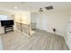 Upper hallway with wood-look flooring and two doors at 209 San Carlo Rd, Davenport, FL 33896