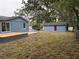 Newly built home with a large backyard, deck, and detached shed at 2104 Newman St, Orlando, FL 32803