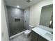 Modern bathroom with walk-in shower and gray tile at 2104 Newman St, Orlando, FL 32803