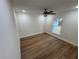 Bright bedroom with wood-look floors and ceiling fan at 2104 Newman St, Orlando, FL 32803