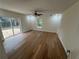 Spacious bedroom with wood-look flooring, sliding door to deck at 2104 Newman St, Orlando, FL 32803