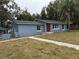 Newly renovated home with red door and blue exterior at 2104 Newman St, Orlando, FL 32803