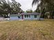 Newly renovated home with red door and blue exterior at 2104 Newman St, Orlando, FL 32803