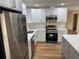 Modern kitchen with stainless steel appliances and island at 2104 Newman St, Orlando, FL 32803