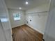 Laundry room with wood-look floors and shelving at 2104 Newman St, Orlando, FL 32803