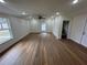 Spacious living room with wood-look flooring and ceiling fan at 2104 Newman St, Orlando, FL 32803