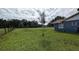 Large grassy backyard with mature trees at 2405 Se 157Th Lane Rd, Summerfield, FL 34491